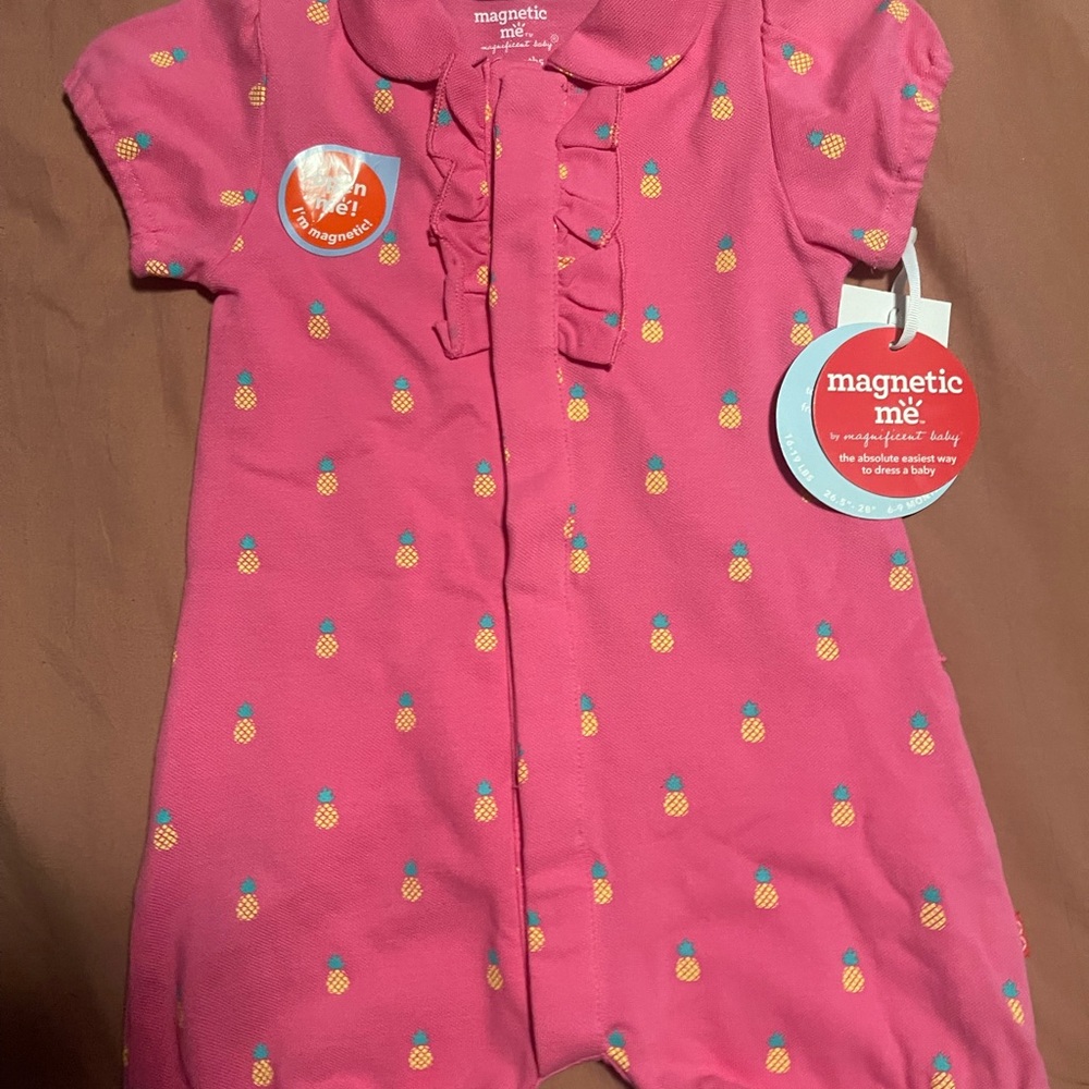 Magnetic me baby girls romper. New with tags on. Never worn. Perfect condition.